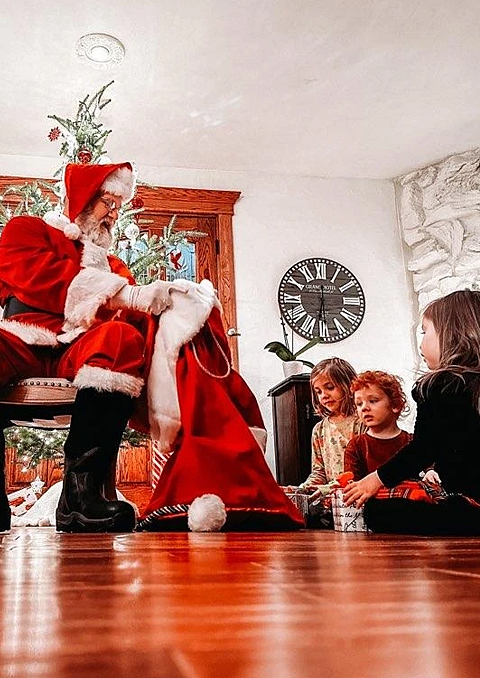 Santa Tom Delivering Gifts To Children